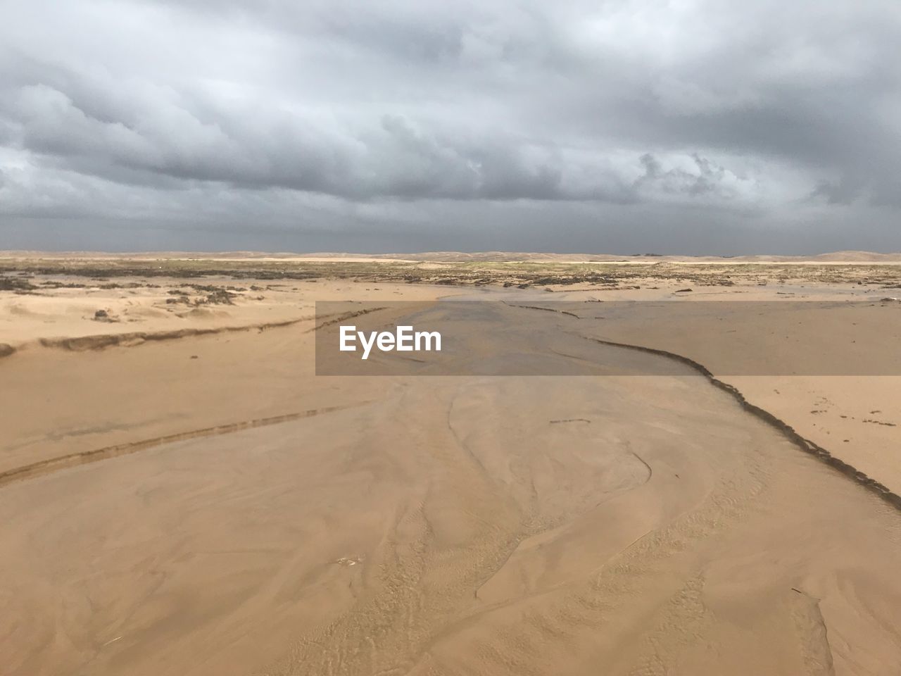 Scenic view of desert against sky