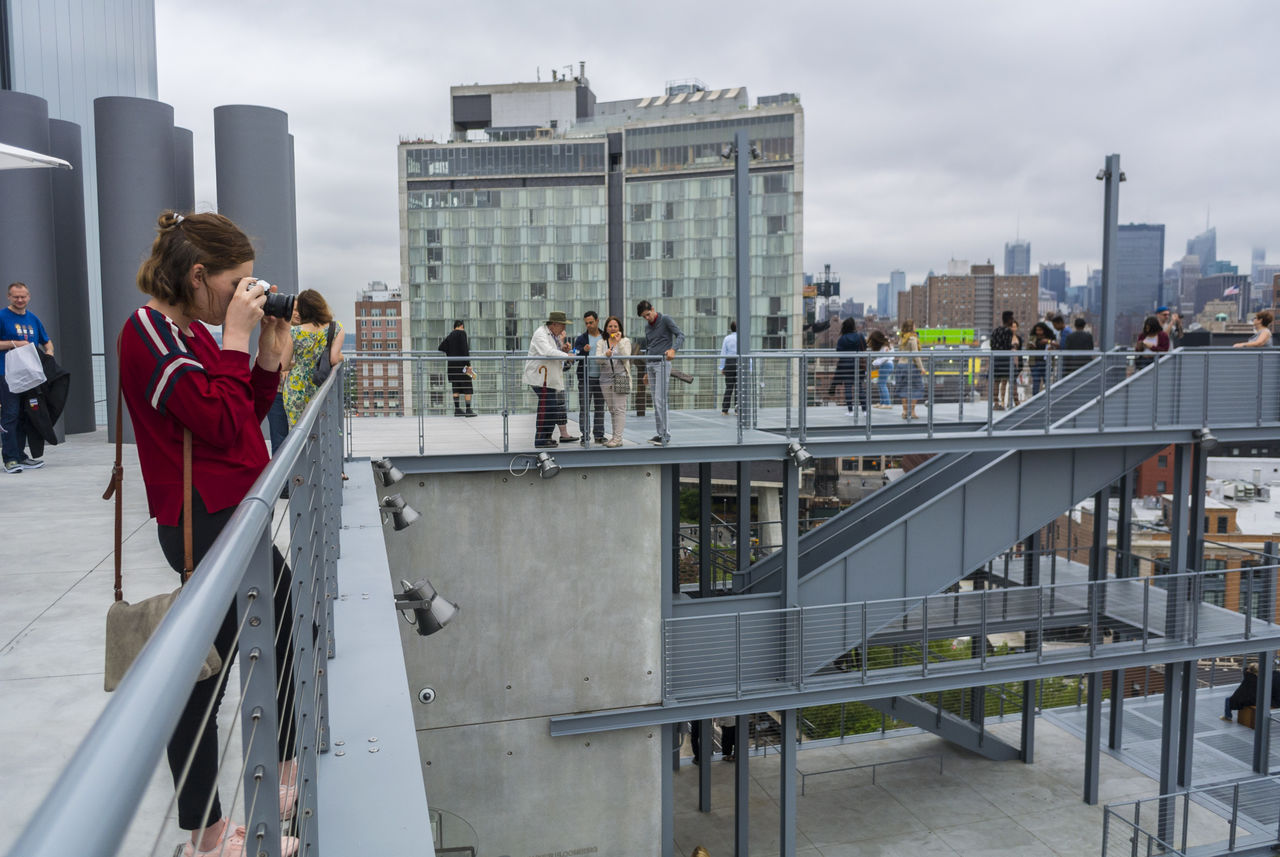 New york, ny, usa, tourists taking photos from roof of whitney museum of art 