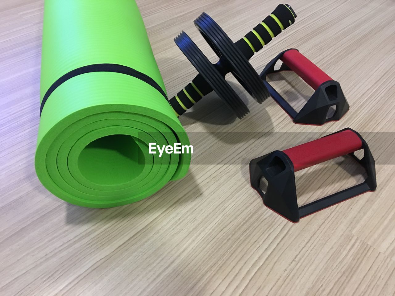 High angle view of gym equipment on hardwood floor