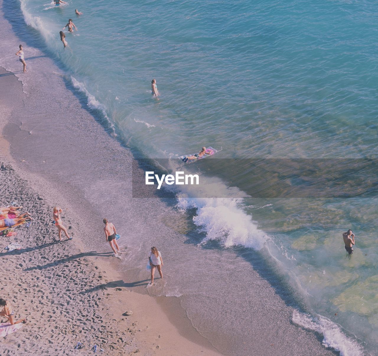 High angle view of people enjoying at beach