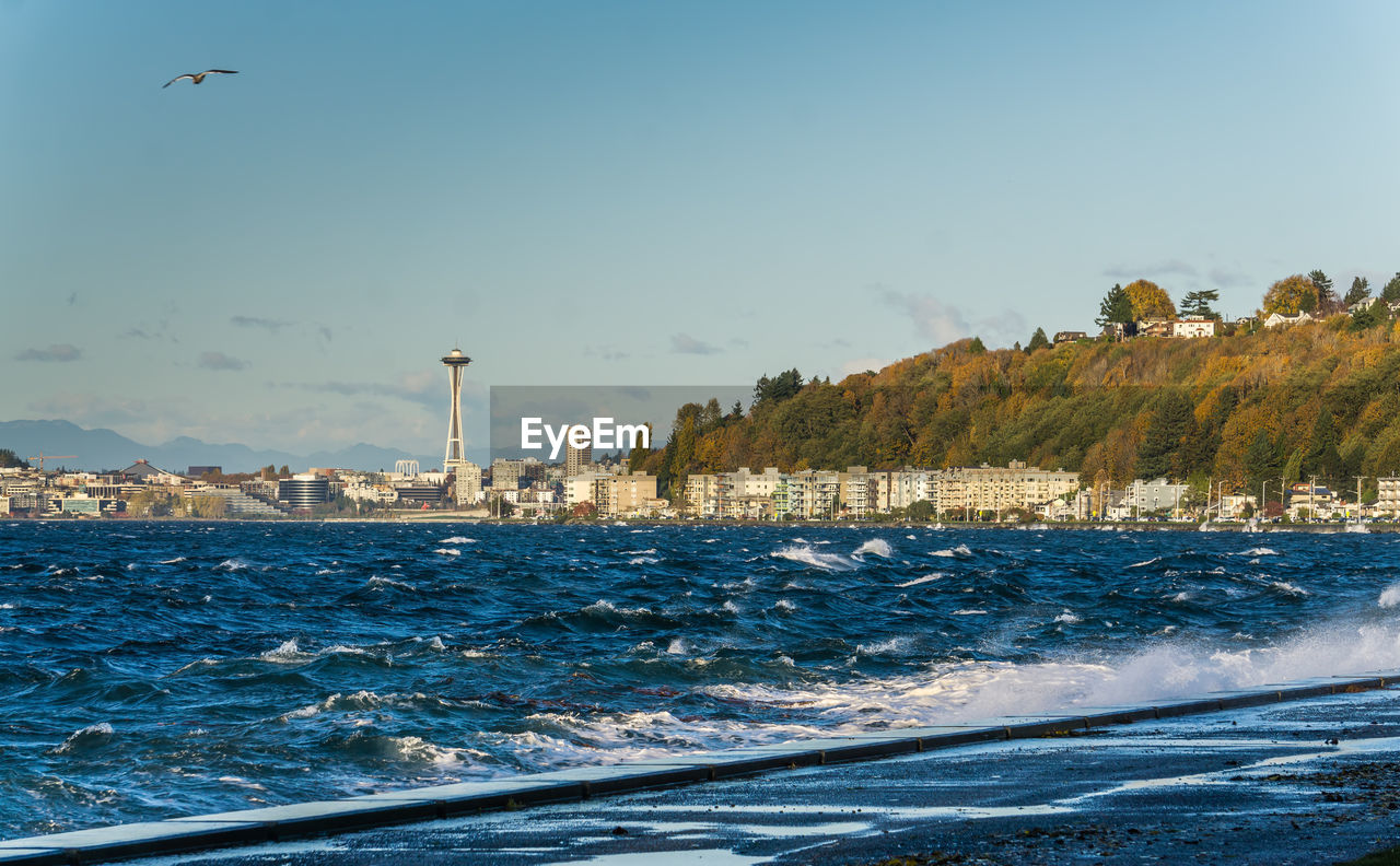 A view of elliott bay with alki beach condos in the distance.