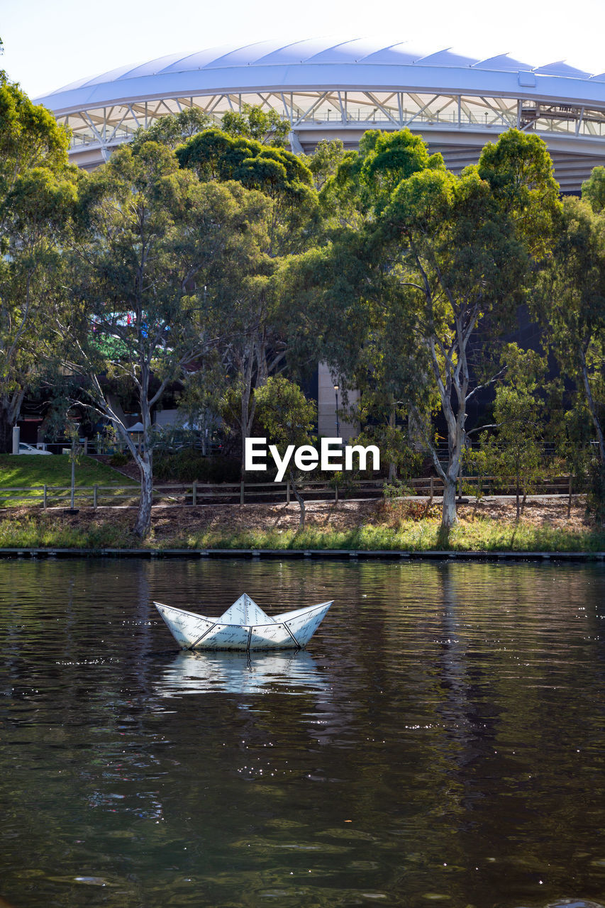 Artistic boat floating over lake