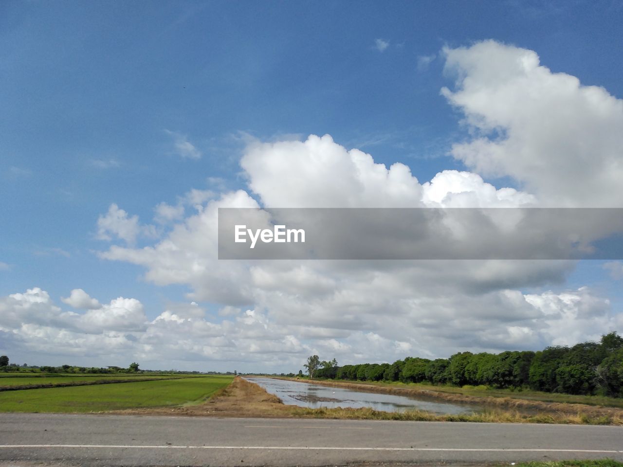 cloud, sky, horizon, environment, road, nature, landscape, transportation, sea, land, no people, rural area, blue, travel, water, day, field, beauty in nature, scenics - nature, plain, plant, coast, outdoors, travel destinations, highway, grass, shore, cloudscape, tree, tourism, tranquility, non-urban scene, tranquil scene