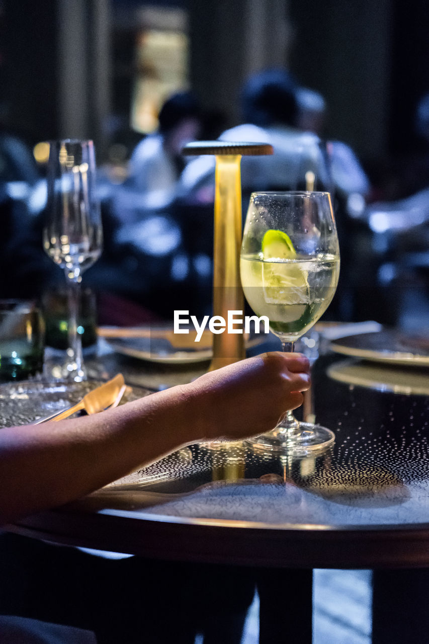 WINEGLASS ON TABLE AT RESTAURANT