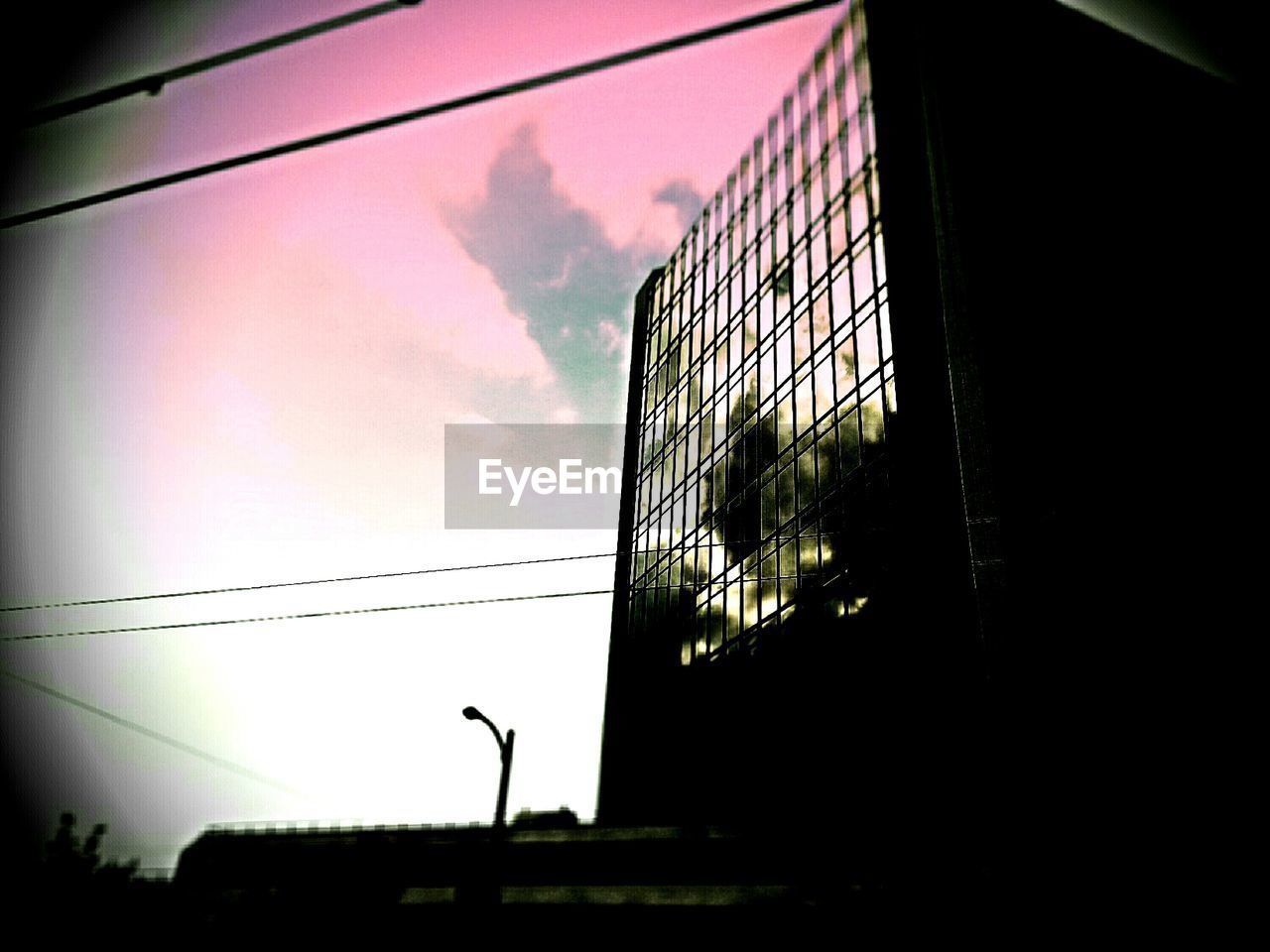 LOW ANGLE VIEW OF MODERN BUILDINGS AGAINST SKY