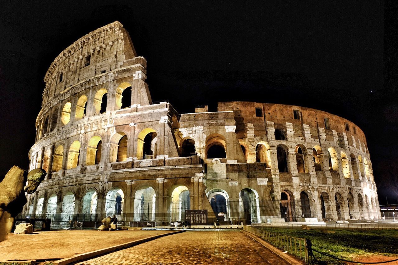 Low angle view of historical building at night