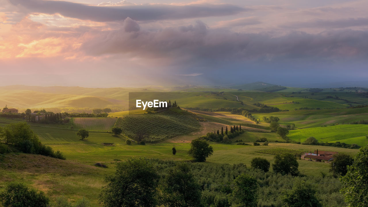 Scenic view of landscape against sky during sunset