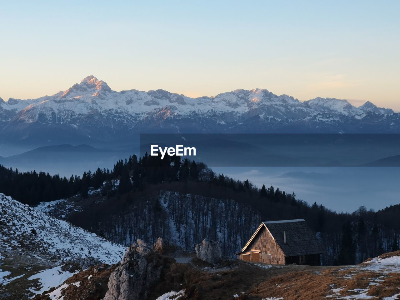 Scenic view of snowcapped mountains against sky