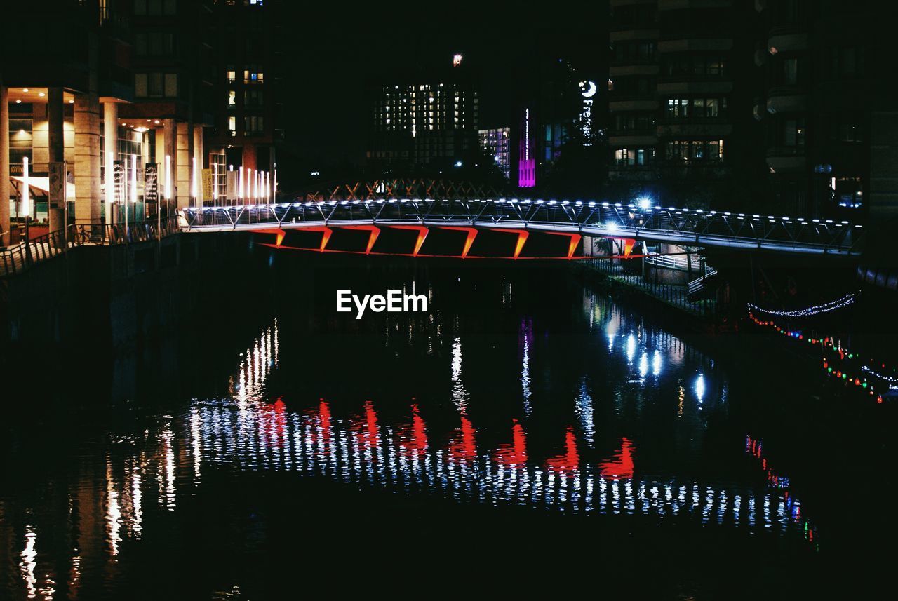 VIEW OF ILLUMINATED BUILDING AT NIGHT