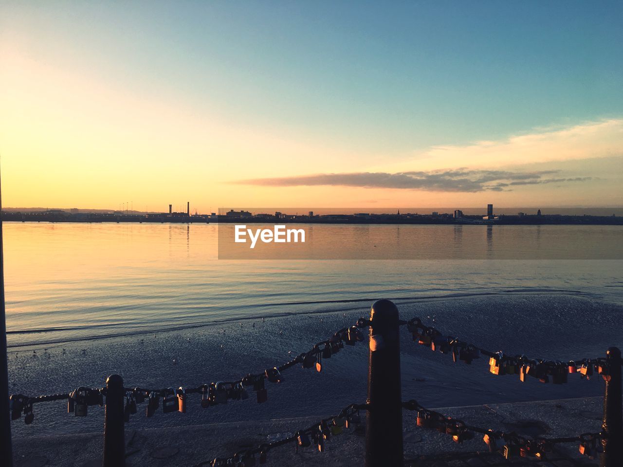 PIER ON SEA AGAINST SKY DURING SUNSET