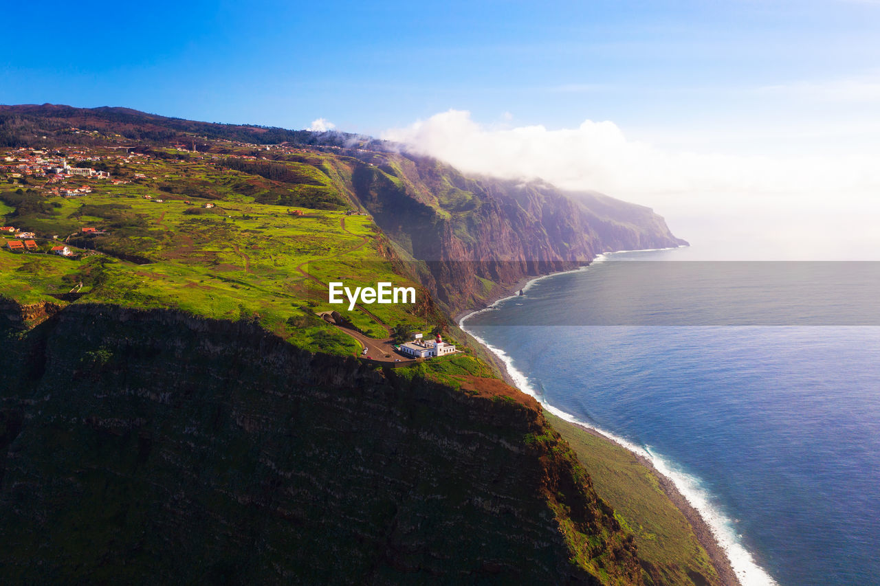 scenic view of sea against mountain