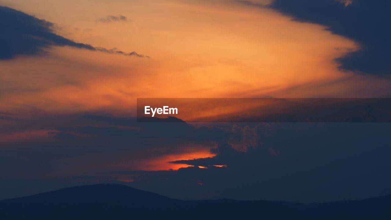 Scenic view of dramatic sky during sunset