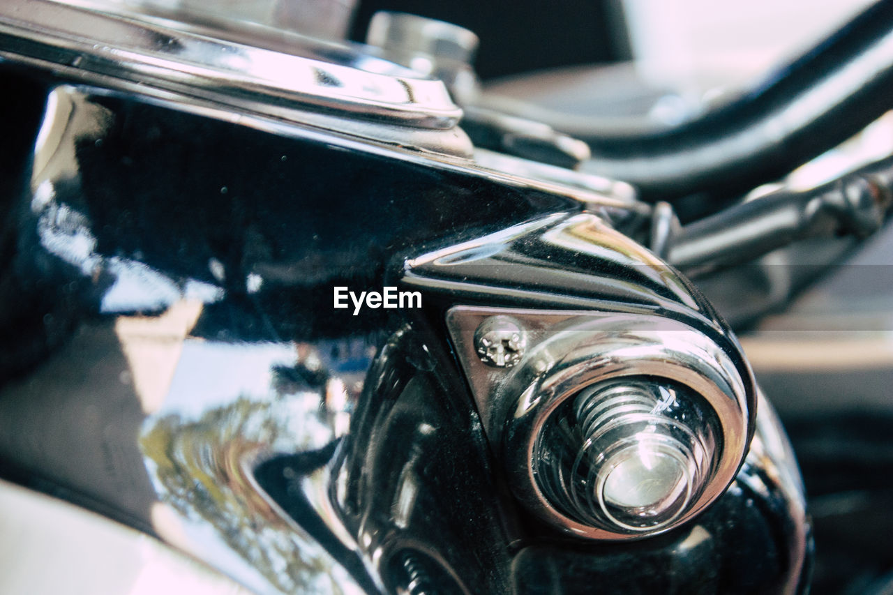 CLOSE-UP OF BICYCLE ON METAL