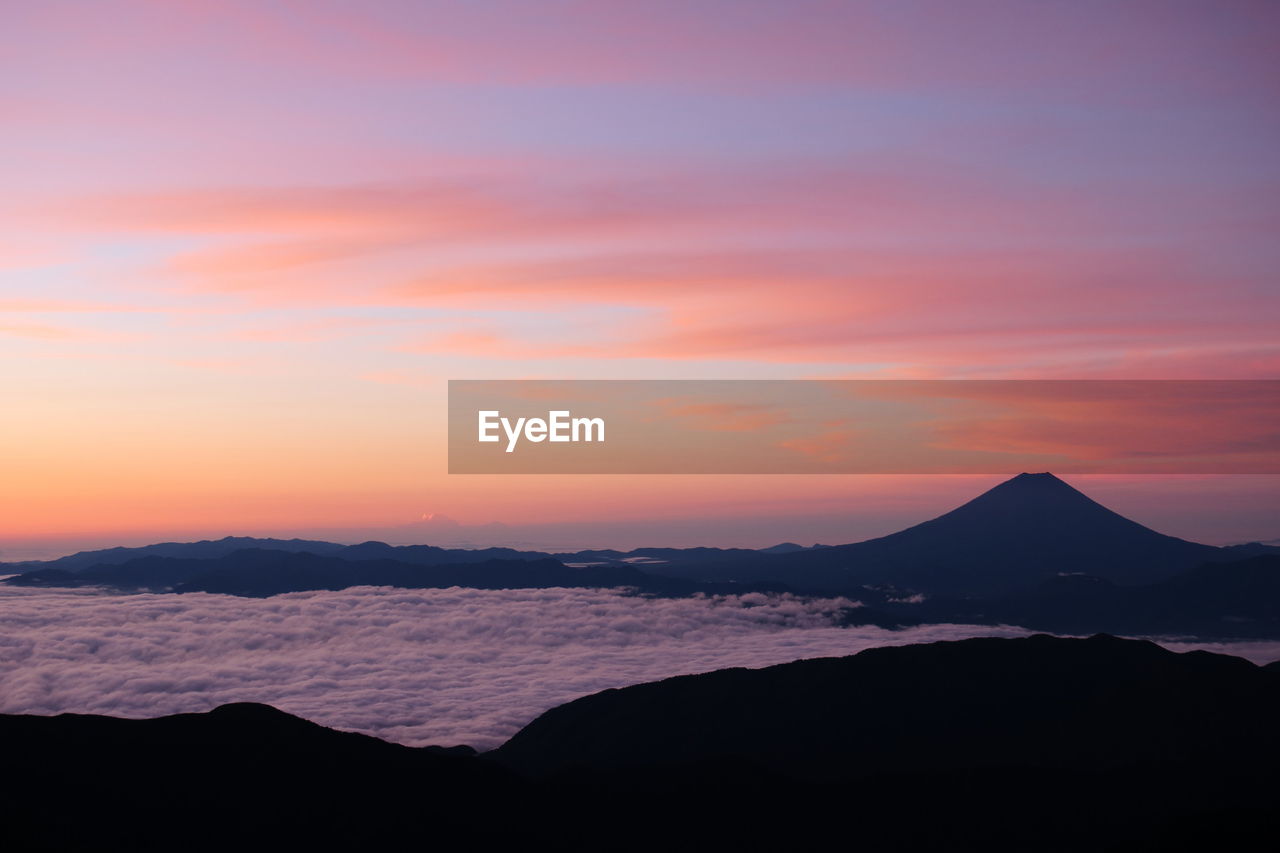 Scenic view of mt fuji and clouds during sunrise