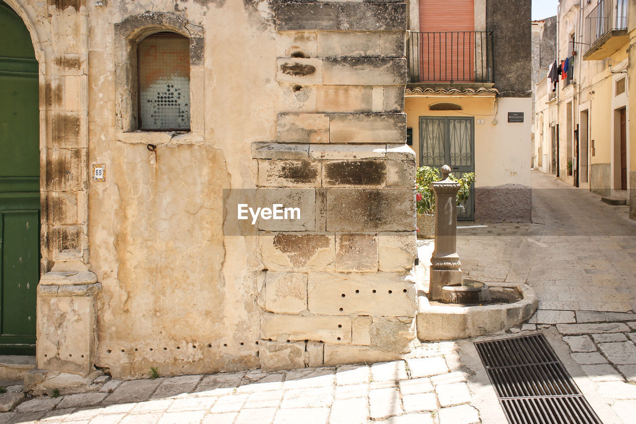 STREET AMIDST BUILDINGS IN CITY