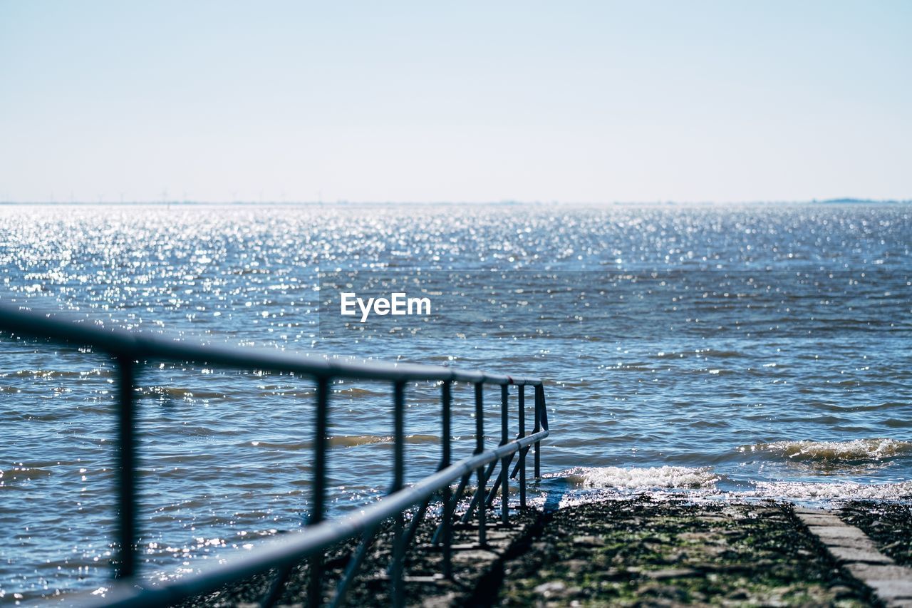 Handrail leading to the sea