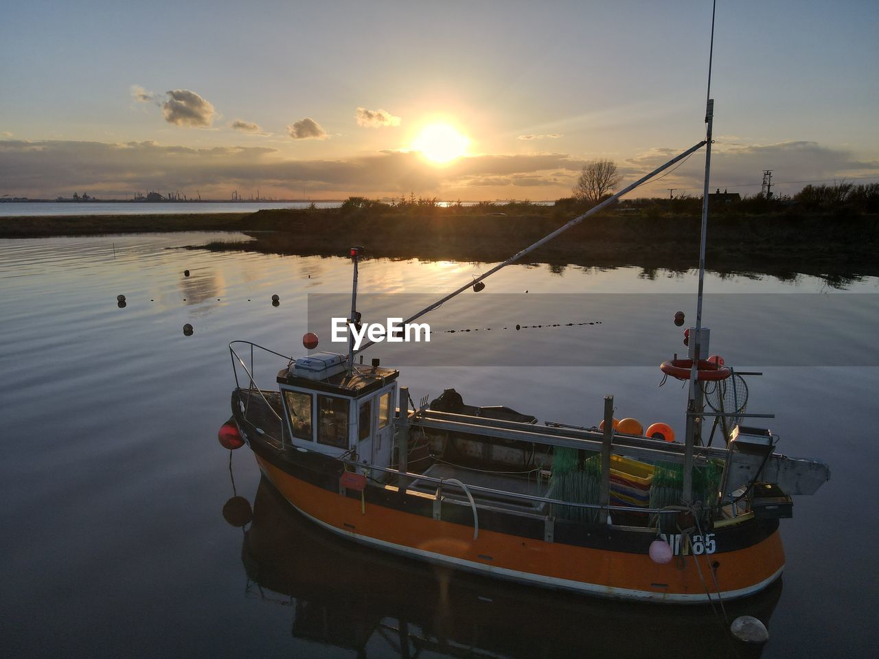 Small fishing boats moored at stone creek inlet, sunk island, east yorkshire, uk