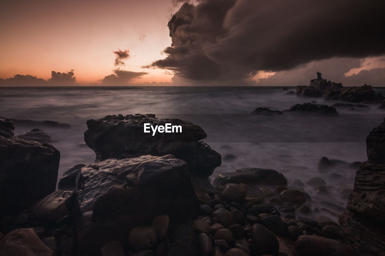 Scenic view of sea against sky during sunset