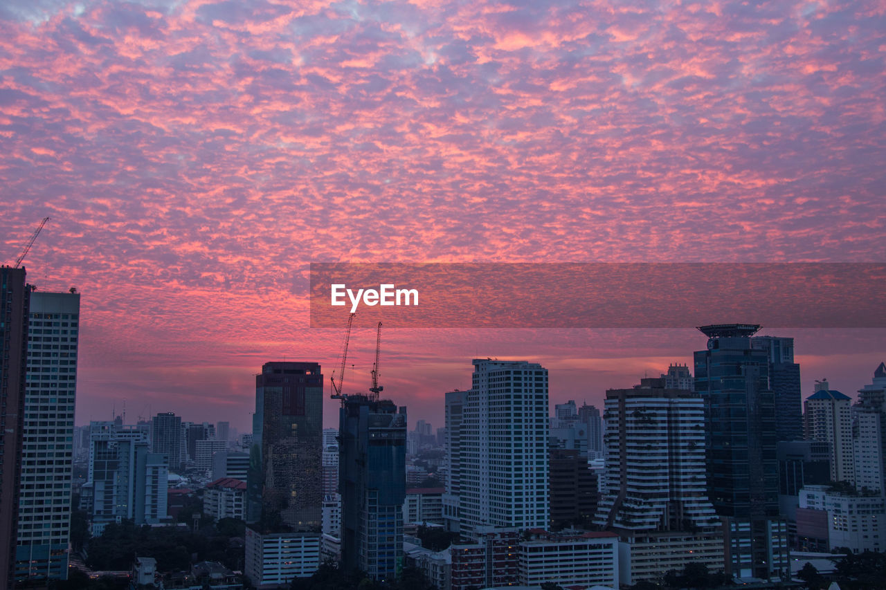 Cityscape against sky during sunset