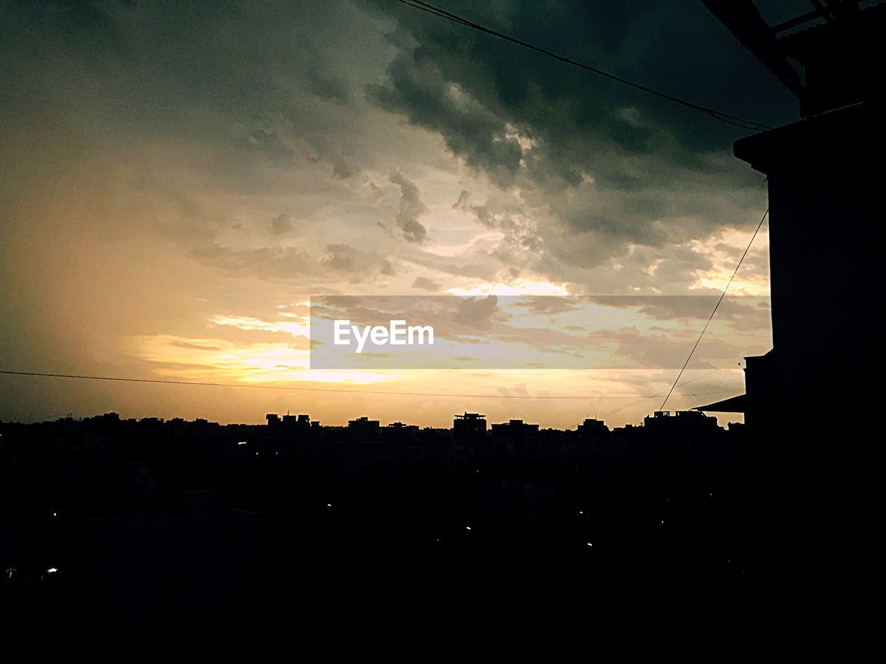 SILHOUETTE OF BUILDINGS AT SUNSET