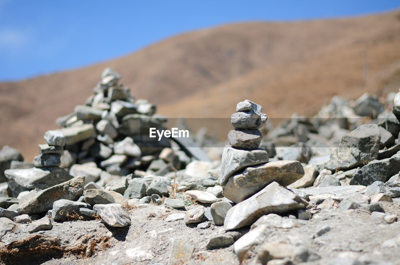 Stack of stones with mountain in background