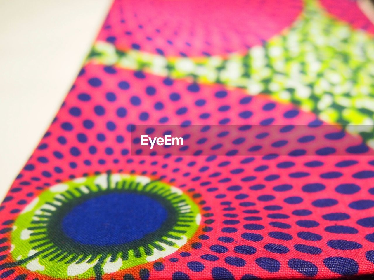 Close-up of multi colored patterned fabric on table