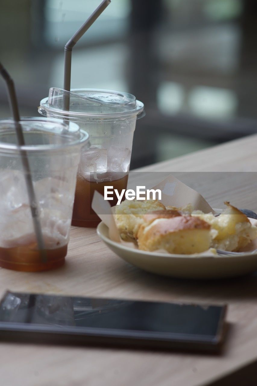 food and drink, food, drink, breakfast, fast food, glass, meal, freshness, table, refreshment, drinking glass, household equipment, healthy eating, soft drink, no people, indoors, brunch, produce, wellbeing, wood, dish, dessert, dairy, day, still life, selective focus, drinking straw, restaurant, plate, close-up, frozen, kitchen utensil, straw