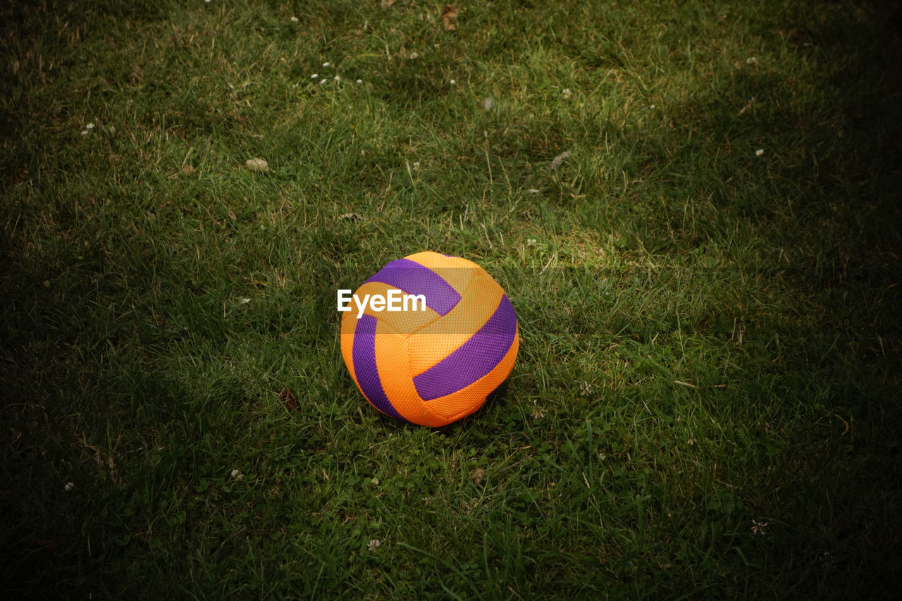 grass, ball, high angle view, field, no people, outdoors, sport, playing field, nature, day, multi colored