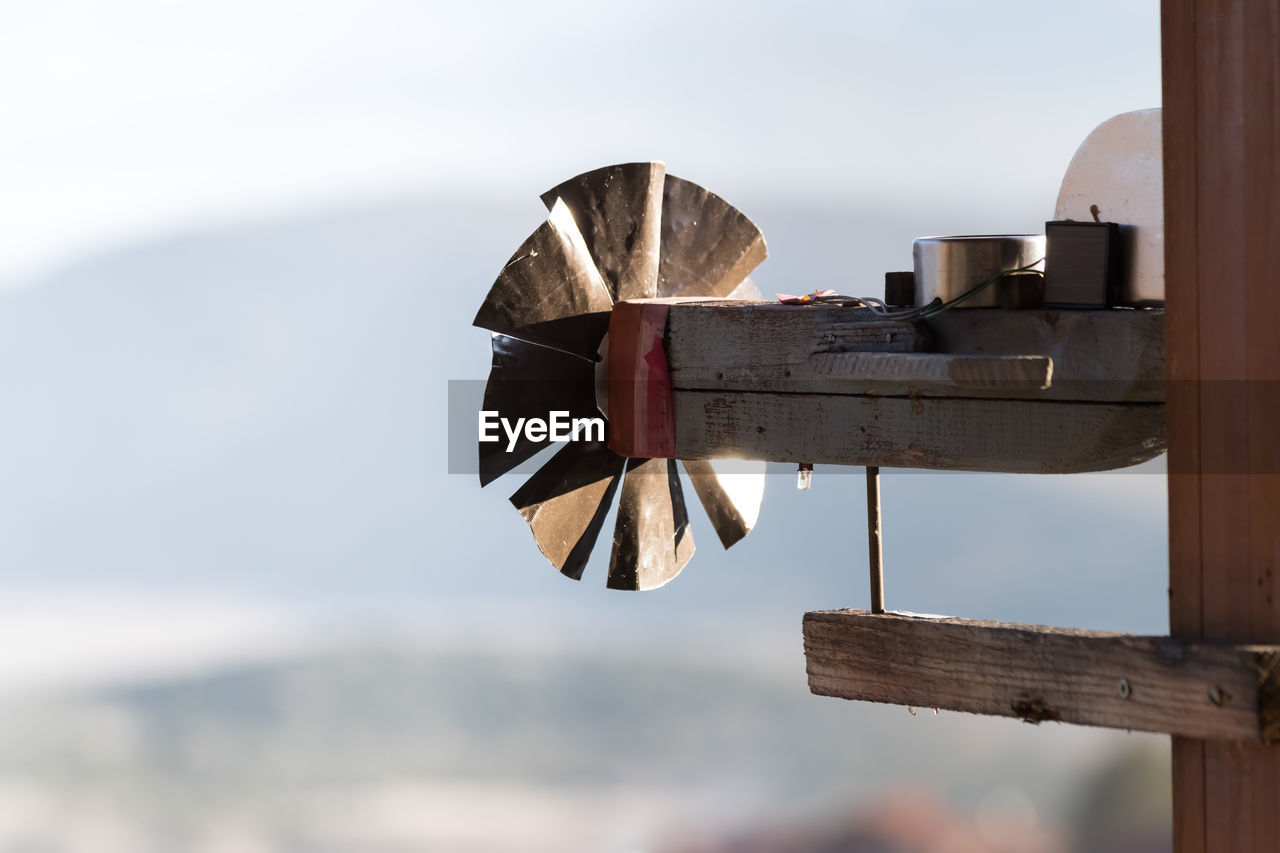 Low angle view of old metallic structure against sky