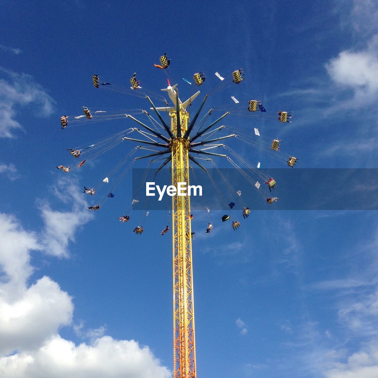 Low angle view of amusement park ride against sky