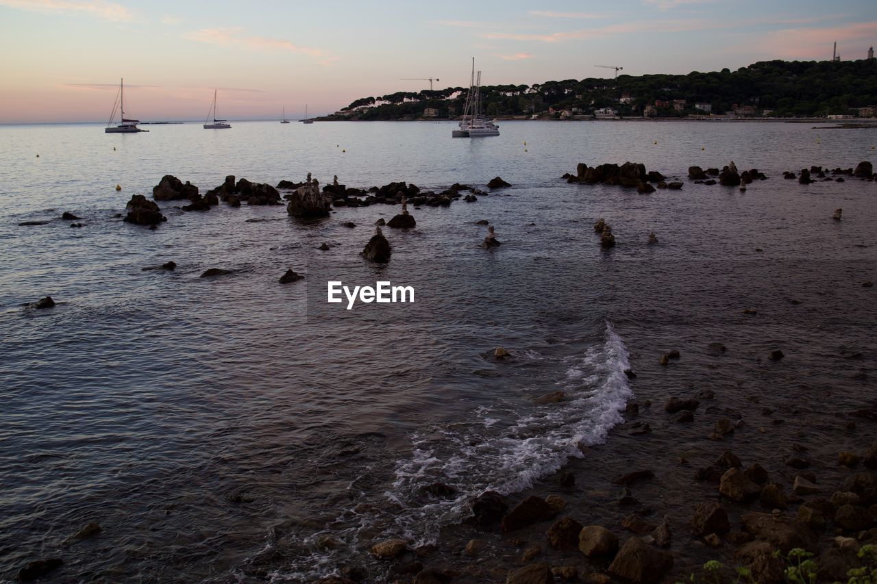 Scenic view of sea against sky at sunset