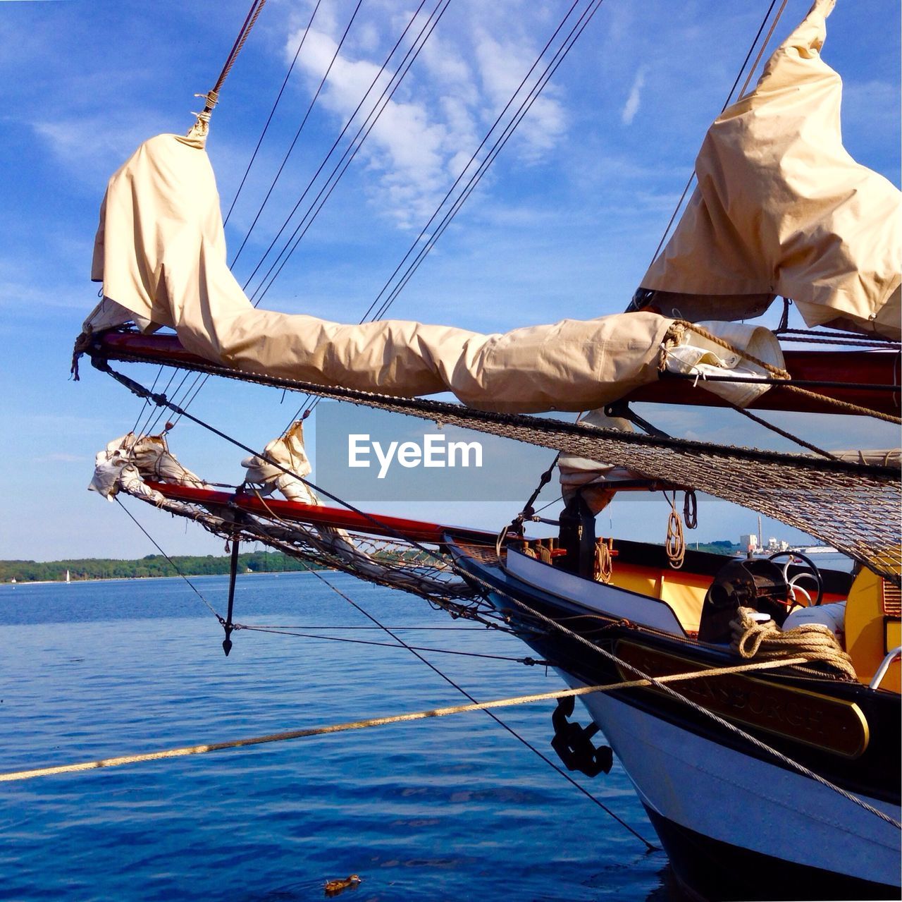 Cropped boat in blue sea against the sky