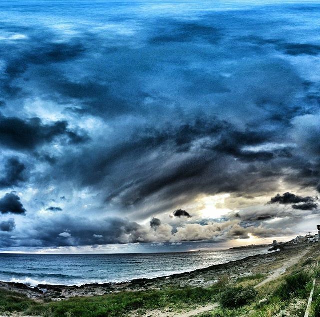 VIEW OF SEA AGAINST CLOUDY SKY