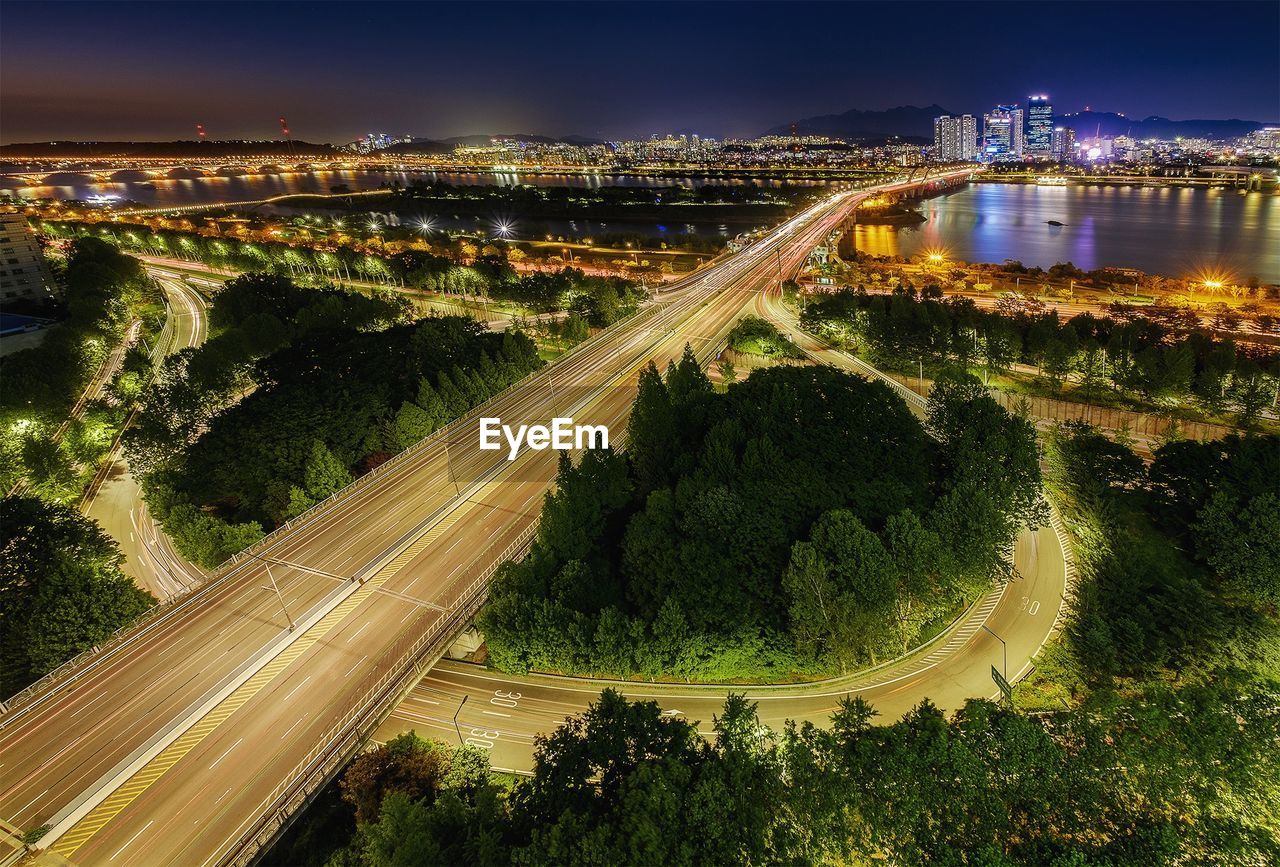 High angle view of light trails on road in city