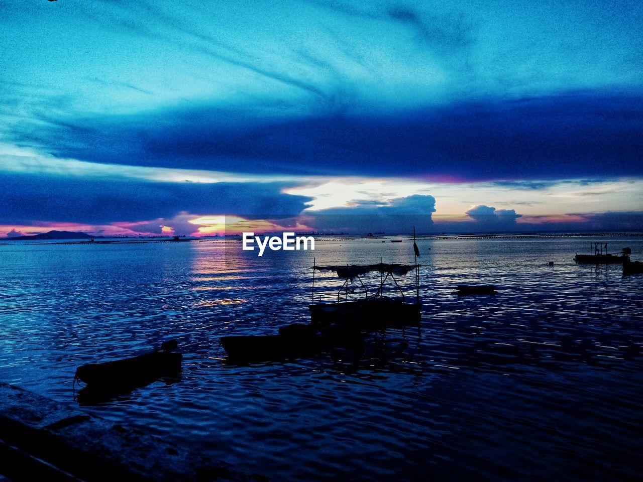 SCENIC VIEW OF SEA DURING SUNSET