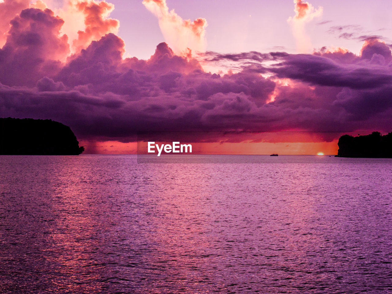 Scenic view of sea against sky at sunset