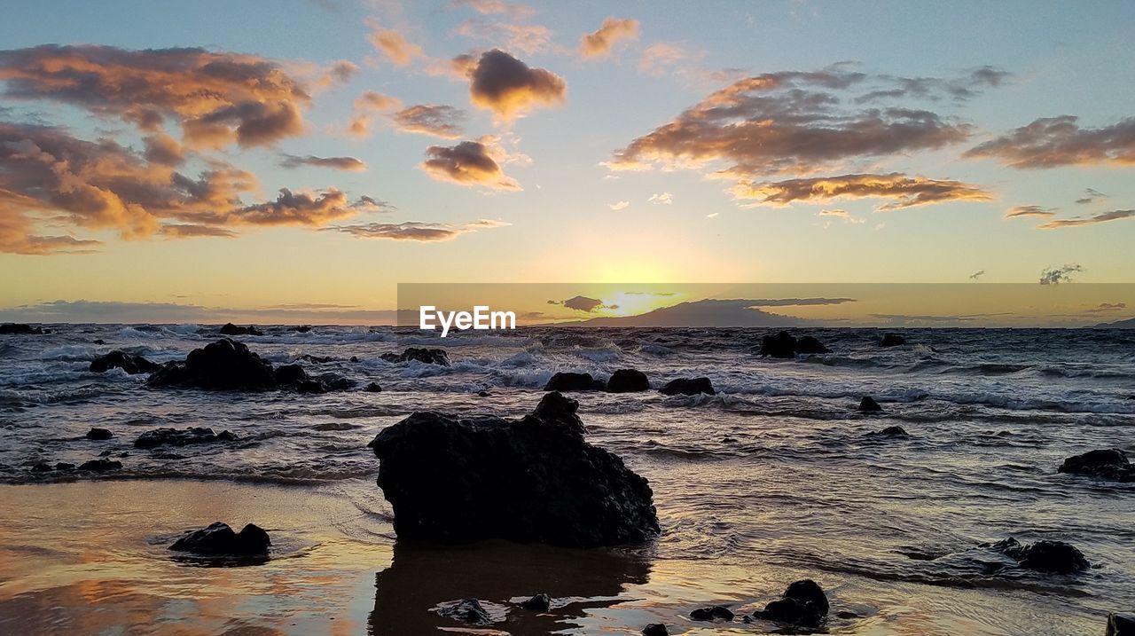 Scenic view of sea against sky during sunset