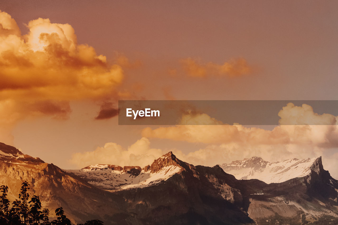 Panoramic view of mountains against sky during sunset