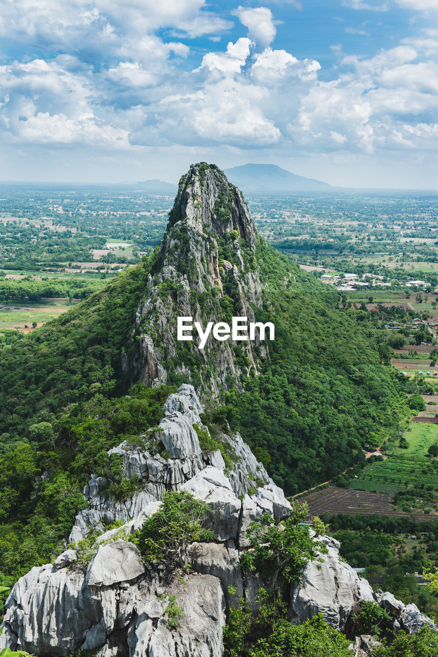 Landscape view from top of khao nor, thailand. thee beautiful limestone mountain against cloudy sky