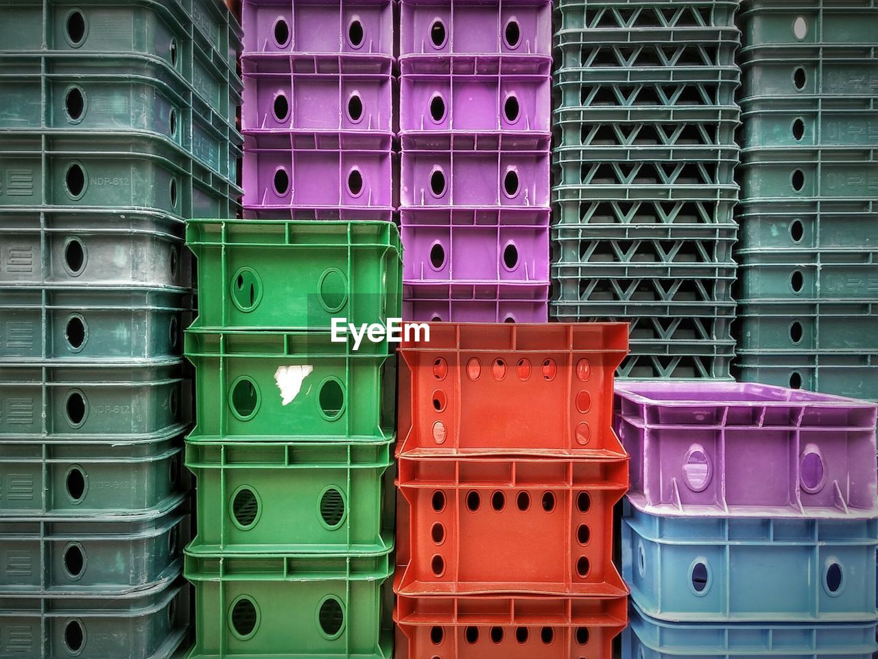 Full frame shot of stacked colorful crates