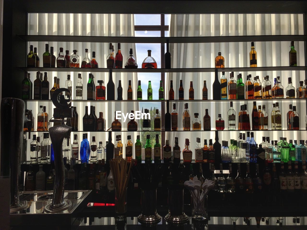 Bottles on shelves at the bar