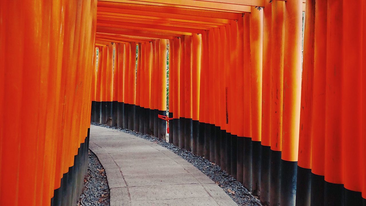 RED STRUCTURE ON ORANGE WALL