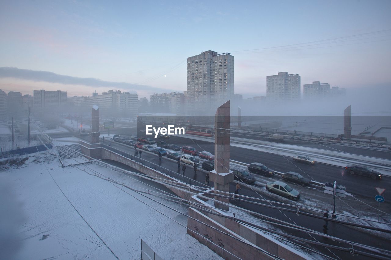 High angle view of cars on road in city during winter