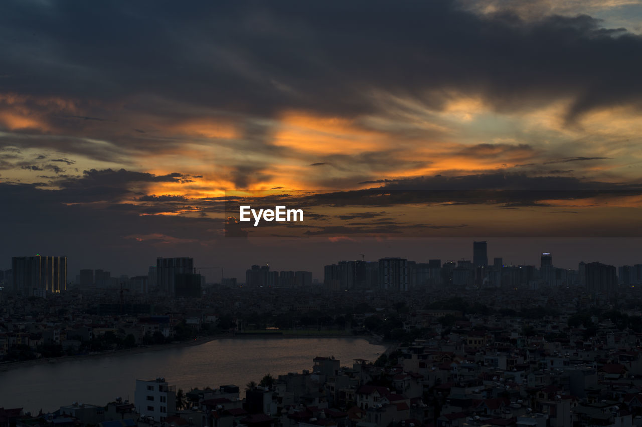 High angle view of buildings against sky at sunset