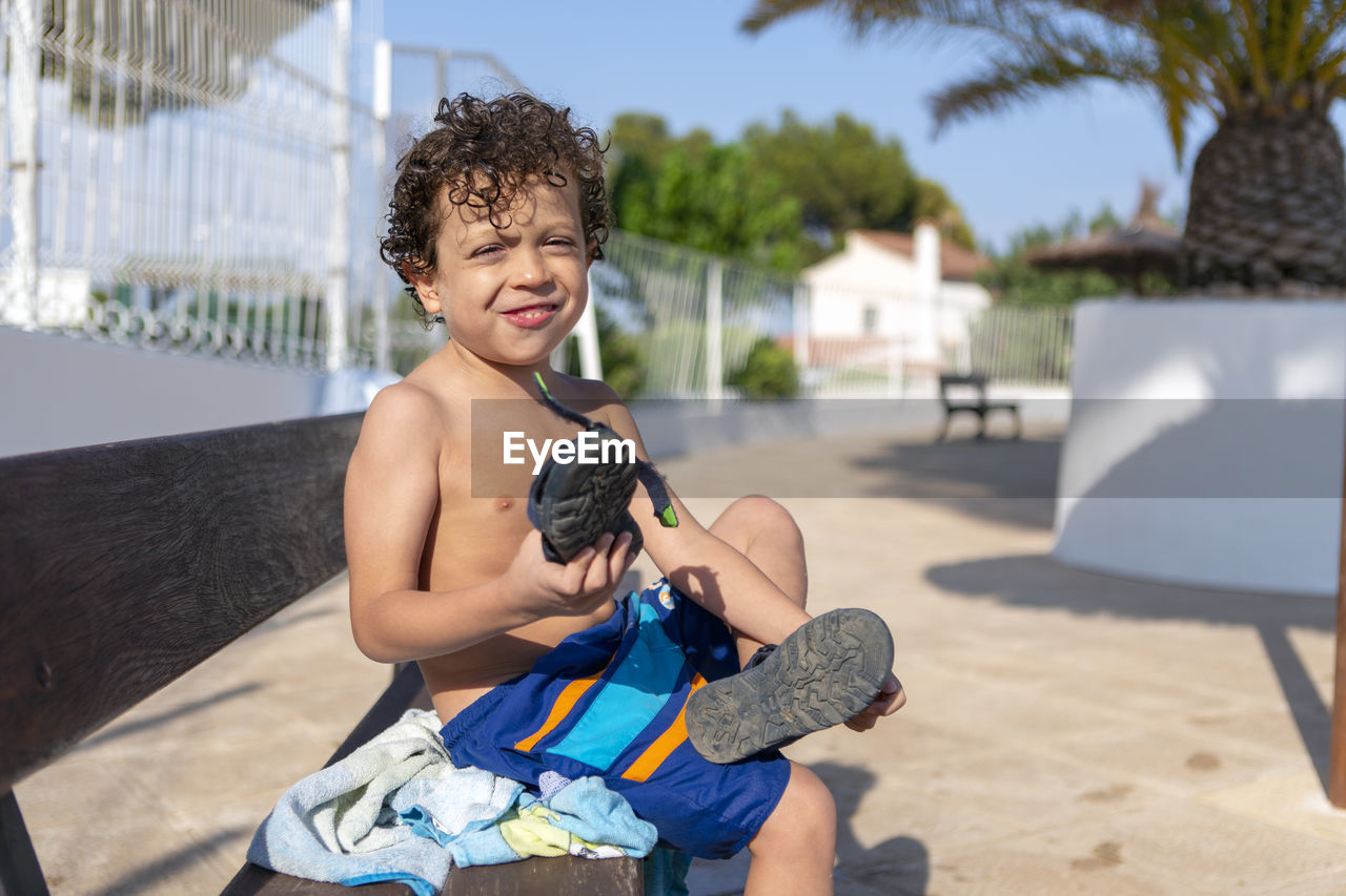 Cute happy child just out of the pool