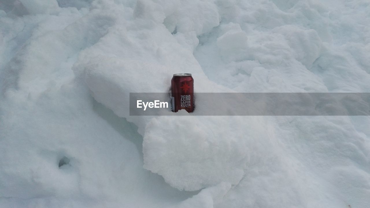 VIEW OF SNOW ON SNOWY FIELD