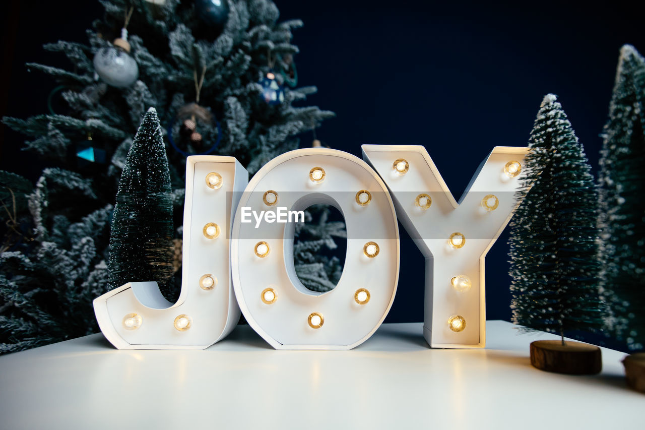 CLOSE-UP OF ILLUMINATED CHRISTMAS TREE