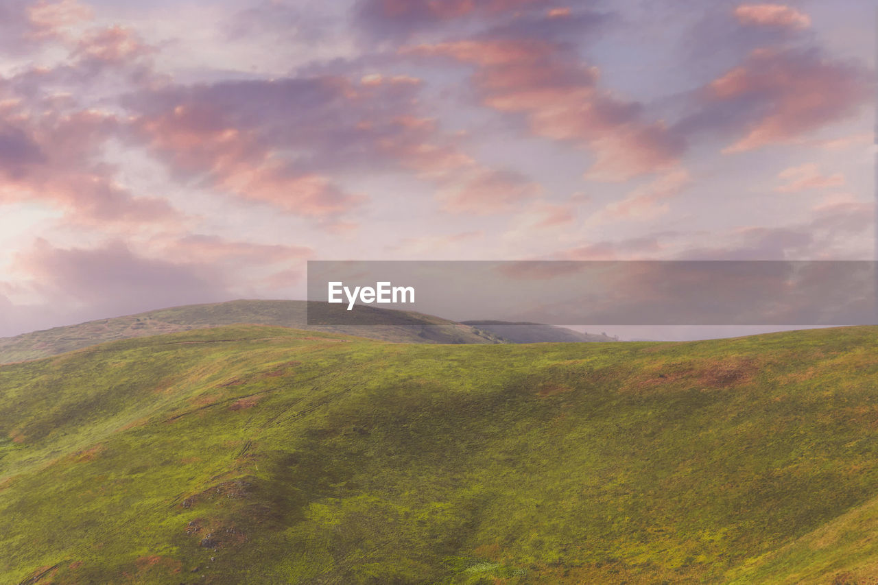 Scenic view of mountains against sky during sunset