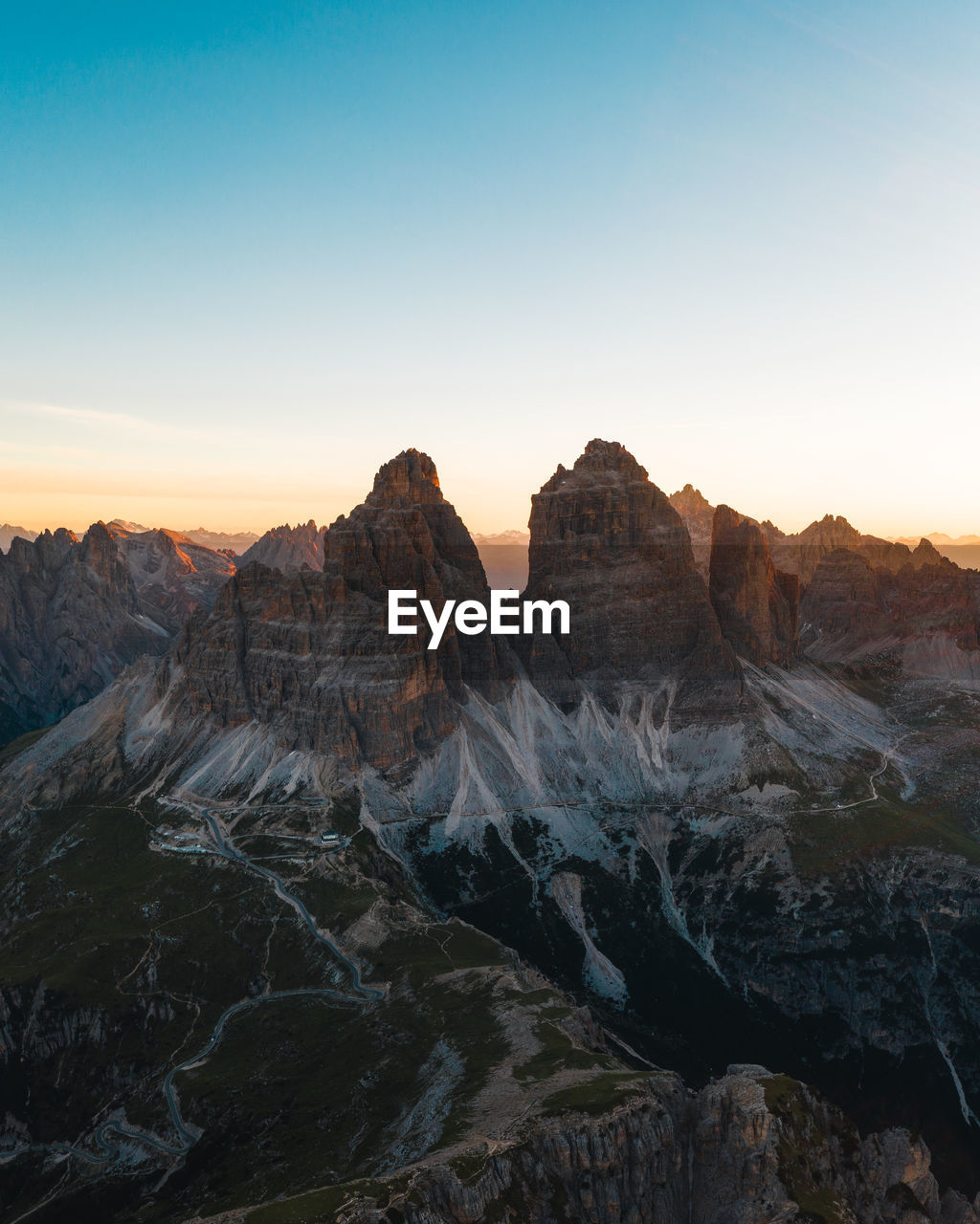 Scenic view of rocky mountains against sky during sunset