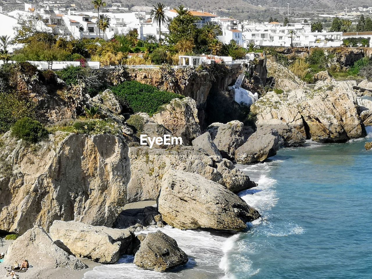 Rocks on shore by sea